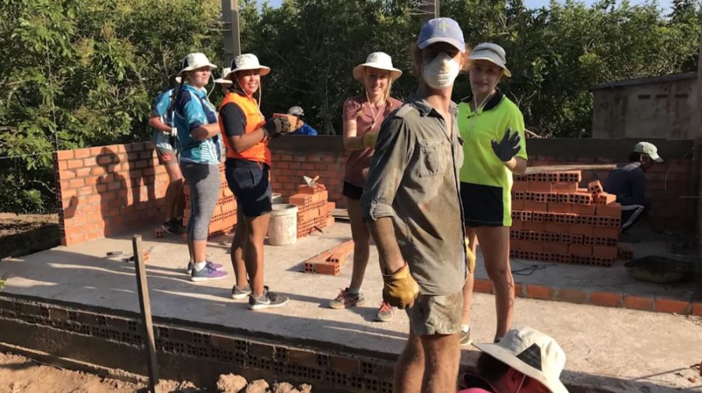 Students working on building a house in Vietnam